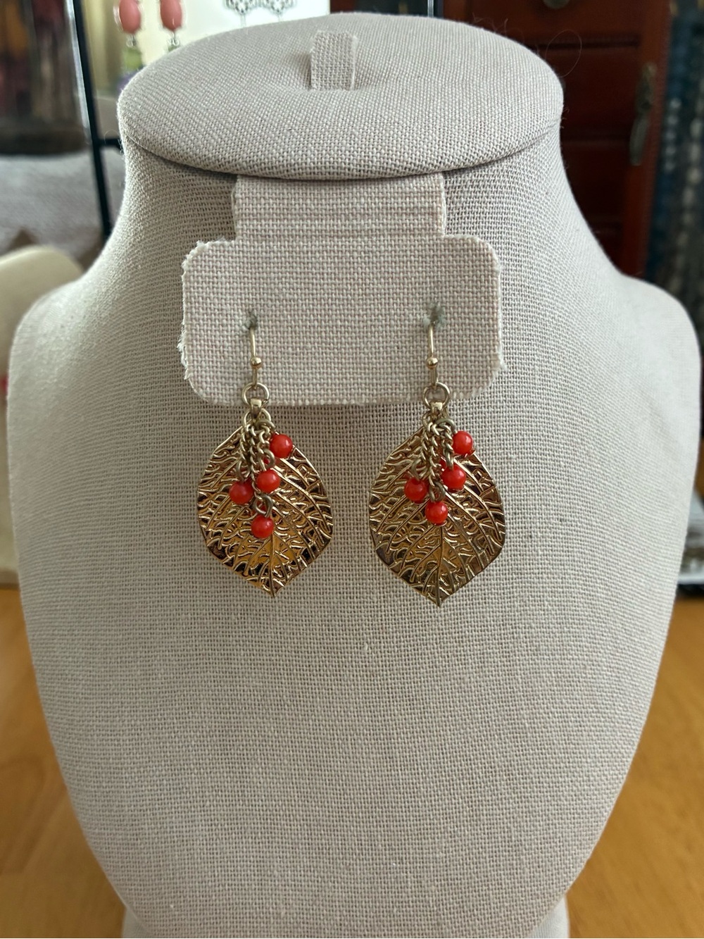 These are fashion earrings featuring gold-tone leaf charms.